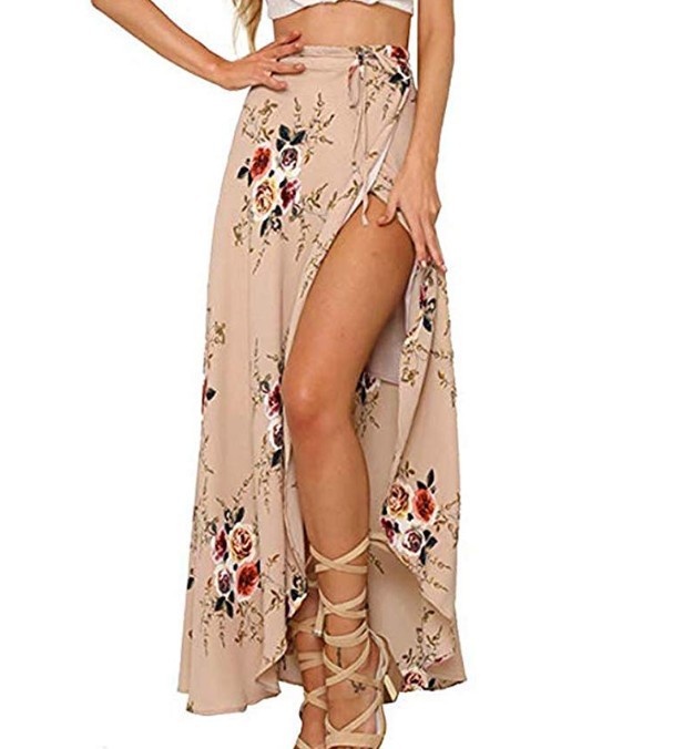 Woman wearing a khaki floral chiffon wrap skirt with a high slit, paired with strappy sandals, perfect for summer beach days and casual outings.