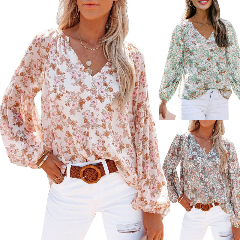 Floral V-neck blouse in pink, green, and grass green with long flowy sleeves.