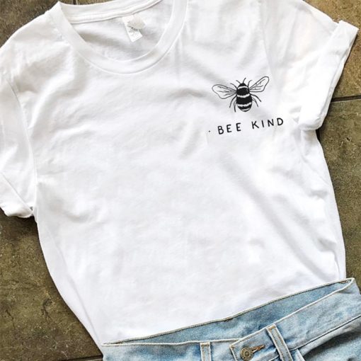 White t-shirt with "Bee Kind" printed alongside a minimalist bee illustration, styled with light blue jeans for a casual, eco-conscious look.