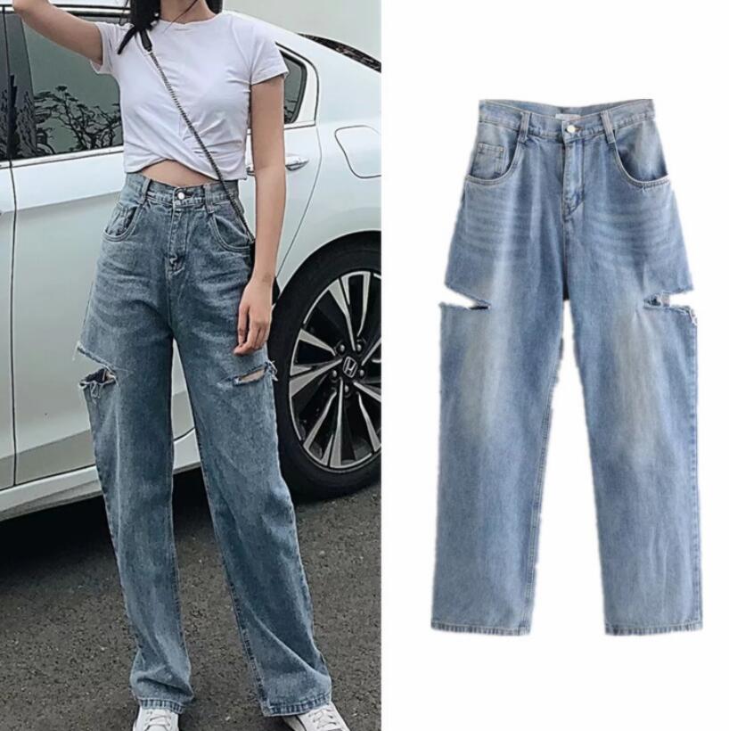 Woman wearing high-waisted wide-leg jeans with cutouts above the knees, paired with a white crop top, shown next to a flat-lay of the jeans.