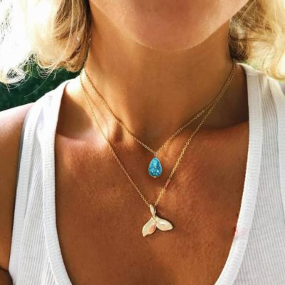 bohemain necklace with a whales tail and stone