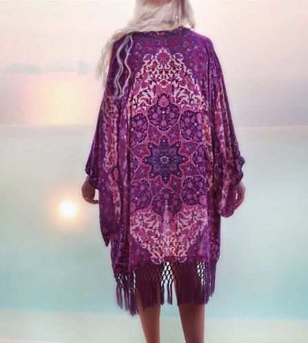 Bohemian fringe beach kimono with vibrant print, V-neck, and long sleeves, perfect for summer and beachwear