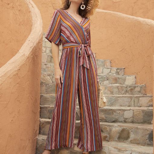 Multicolor ladies jumpsuit with tribal-inspired pattern, V-neckline, and belted waist.